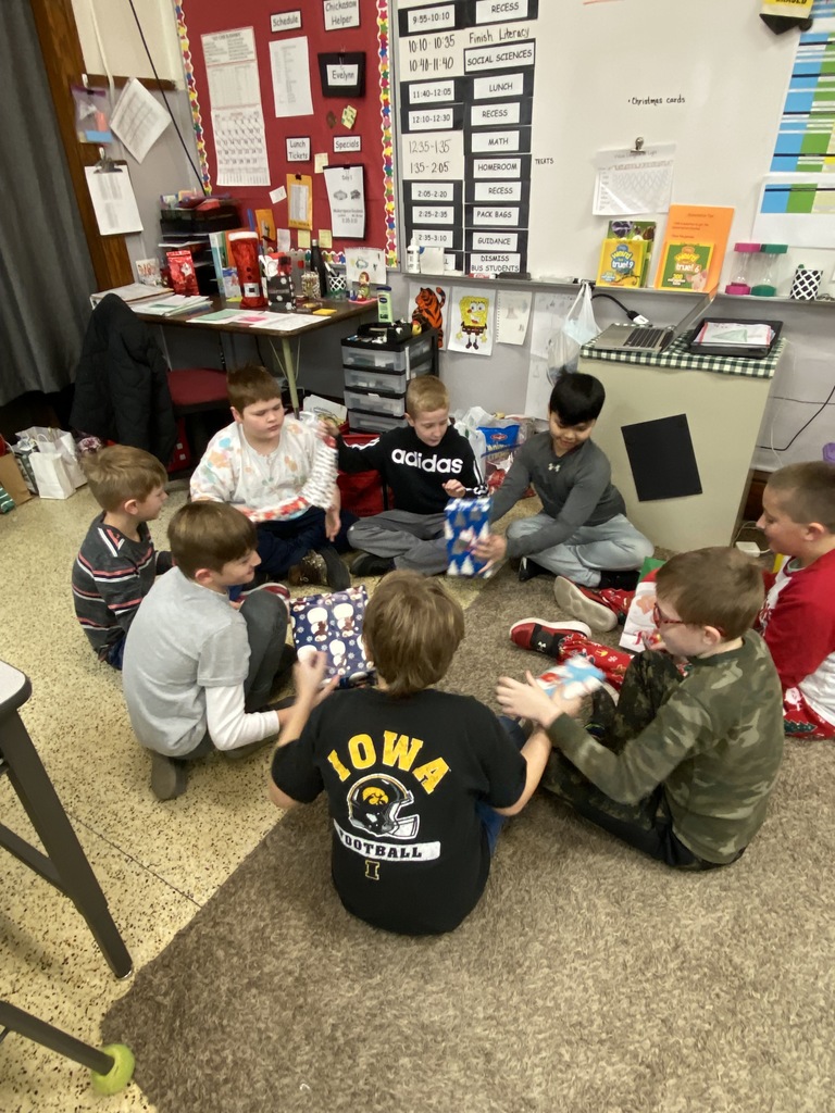 Students played a game for their gift exchange. Mrs. Schwickerath read “The Night Before Christmas” as students passed a present RIGHT or LEFT when they heard those words.  We loved hearing them giggle.  🌲 🎅 