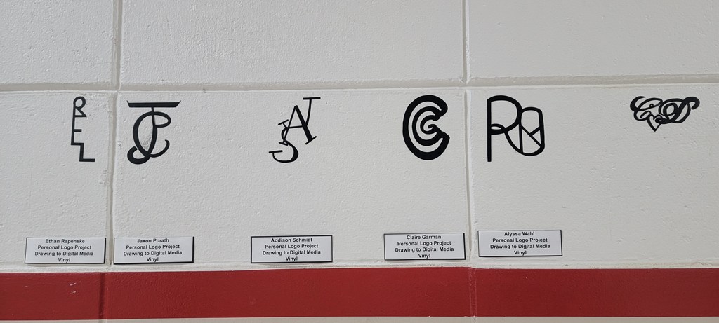 After a discussion on branding of companies, and how artists sign their own work, the high school art students created their own personal logo using their initials.  They drew out many different designs before choosing one. Then they were transferred digital art through Procreate on the Art iPads. Each one was then cut from vinyl and put on the walls of the art hallway. (Don't worry, it's removable!) Students were also given vinyl stickers of their own to share and use! Here are only a few of them!