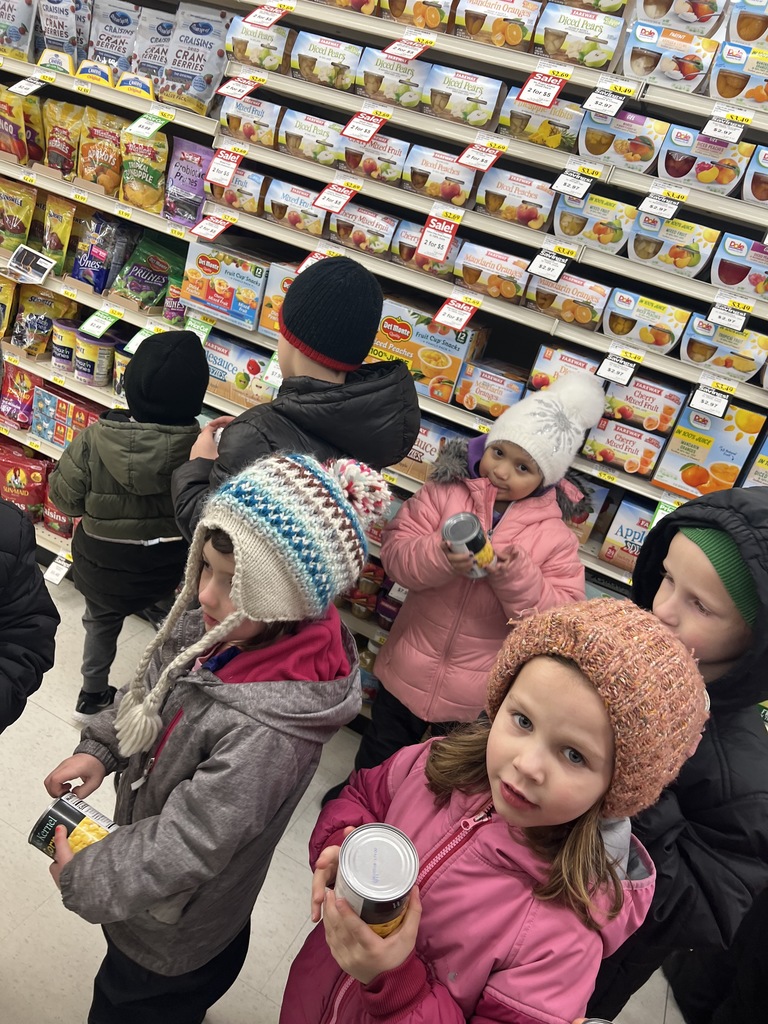 Today, Mrs. Eichenberger's kindergarten class braved the cold and walked to Fareway to buy food to donate to the food drive. Each student had $1 to spend and on the way out, they put their change in the Red Kettle.