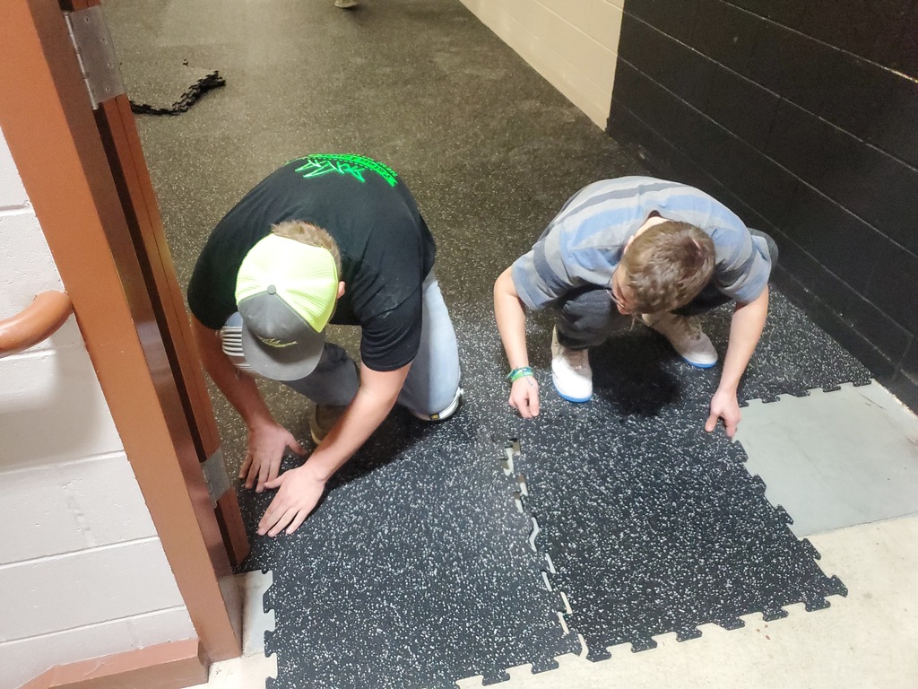 14 students in the high school Construction class  put down the rubber composite floor in the former wrestling room in the Chickasaw Wellness Center.  This saved the Chickasaw Wellness Center money and gave the young men some real life work experience.