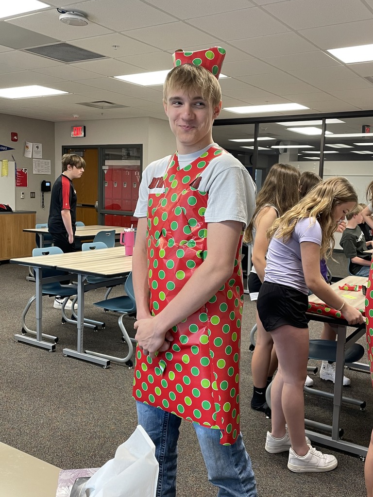 When you find leftover wrapping paper, you find ways to use it up. Our 8th graders got creative 