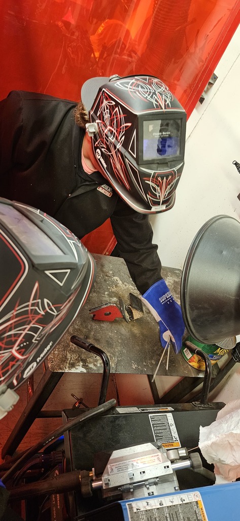 The advanced welding class working on teamwork and small (stick welding)