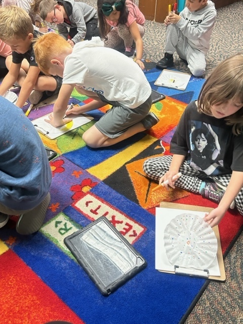 First grade students creating DOTS! International Dot Day is coming up. It is a day to celebrate creativity and the courage to show that creativity.  