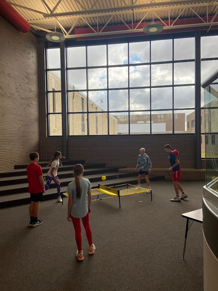 7th and 8th graders enjoying a new game during their TRIBE time at the end of the school day!