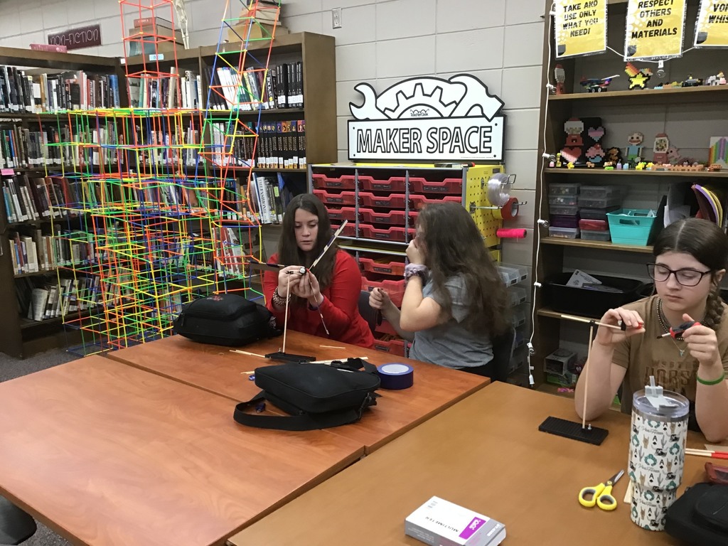 The students built a windmill then tested and adjusted to get it to go faster.