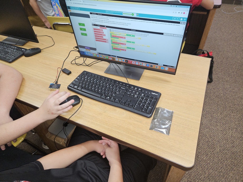 The 8th grade technology class is learning how to code with Microbits! You type the code into the computer and the microbits light up!