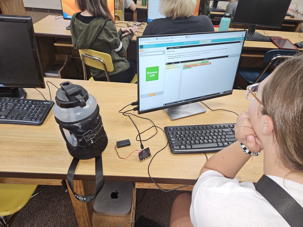 The 8th grade technology class is learning how to code with Microbits! You type the code into the computer and the microbits light up!